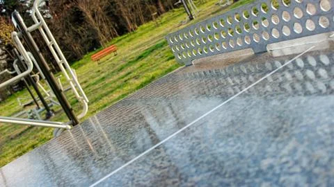 Concrete Ping Pong Table with Metal Net in City Park Stock Photos