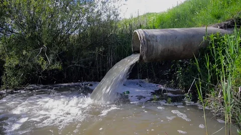 Concrete pipe transporting the polluted sewage water Stock Footage 108523328