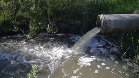 Concrete pipe transporting the polluted sewage water Stock Footage 108523351