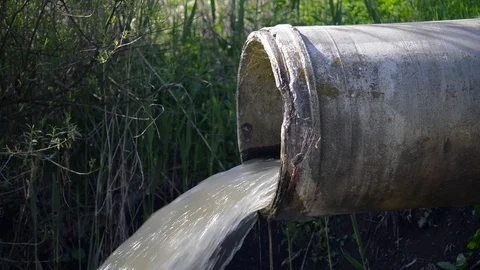 Concrete pipe transporting the polluted sewage water Stock Footage 108523361