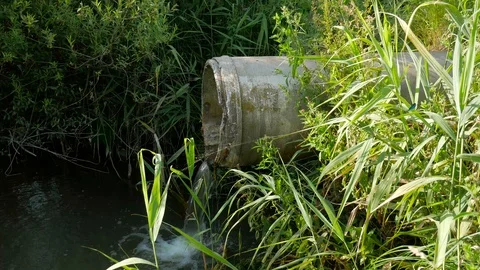 Concrete pipe transporting the polluted wastewater Stock Footage 112658280