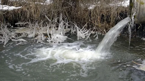 Concrete pipe transporting the polluted water Stock Footage 102262199