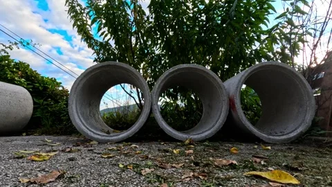 Concrete pipes rolling down hill Video stock 319421517