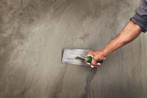 Concrete plasterers to create industrial workers background walls with plas.. Stock Photos
