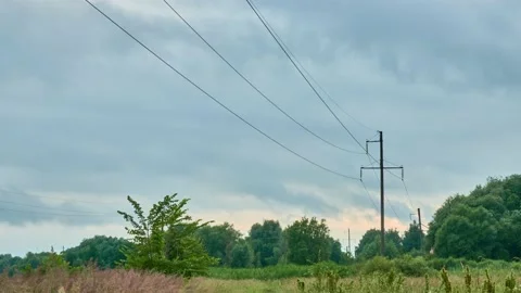 Concrete pole with high-voltage electric wires against the background of the  Stock Footage 158025371