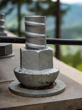 Concrete post head nut with painted steel surface. Footpath bridge Concret... Stock Photos