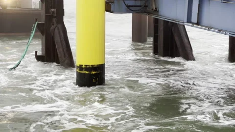 Concrete post in water with waves around it. Stock Footage 231174869