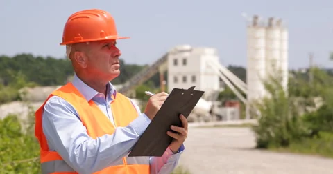 Concrete Pour Technology Engineer Calculate Clipboard Cement Tower Containers Stock-Footage 50950955