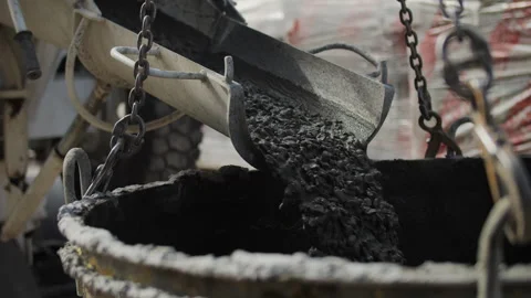 Concrete is poured into a construction barrel Stock Footage 279910400