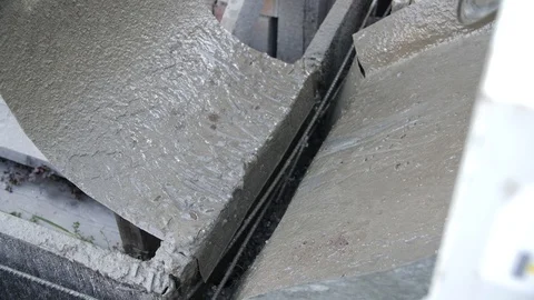 Concrete pouring. Construction worker mixing mortar. Pouring concrete mix from Stock Footage 95290853