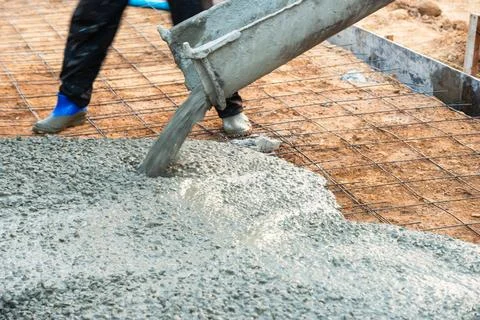 Concrete pouring process at construction site industry work in progress pro.. Stock Photos