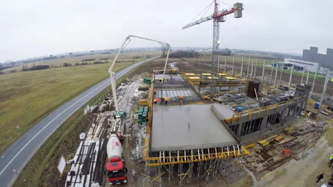 Concrete pouring on upper floor slab at European construction site 库存影片 317253217