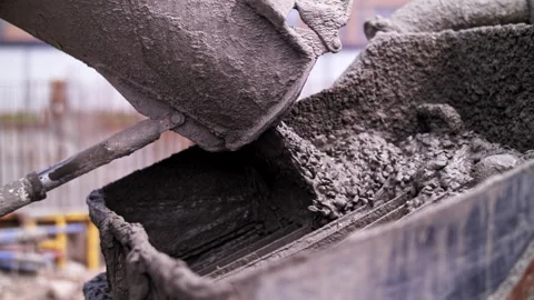 Concrete pours from a mixer Stock Footage 241497015