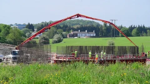 Concrete pump lorry delivering cement to east leeds orbital road uk Stock Footage 211666025
