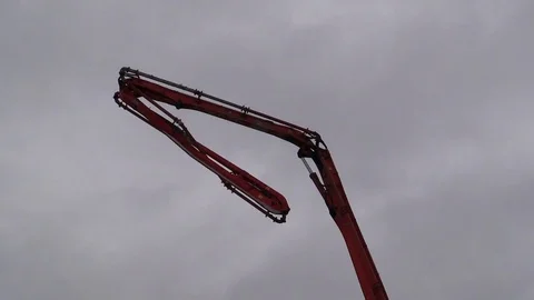 Concrete pump machine fold down boom after complete work and leave away. Stock Footage 83504356