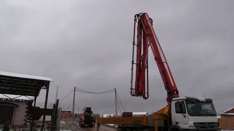 Concrete pump machine fold down boom after complete work and leave. Time lapse. Stock Footage 83504390