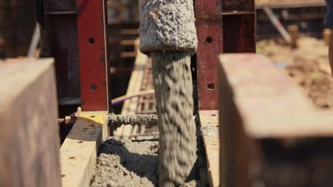 Concrete pump pouring wet cement into formwork Stock Footage 341294624