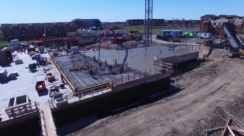 Concrete pump working a foundation pour Stock Footage 64146686