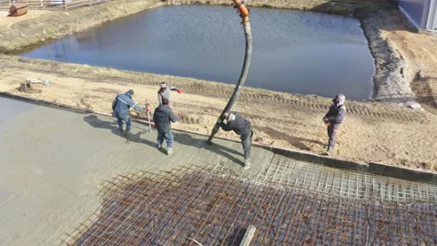 Concrete pump works on construction. Workers pour cement mortar from pump Video stock 148447510
