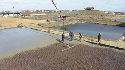 Concrete pump works on construction. Workers pour cement mortar from pump Stock Footage 148448530