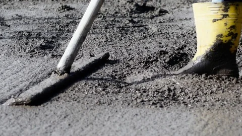 Concrete rake does a better job smoothing out chunky concrete mix Stock Footage 71328781