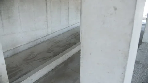 Concrete ramp inside unfinished multi level parking structure Stock Footage 311461784