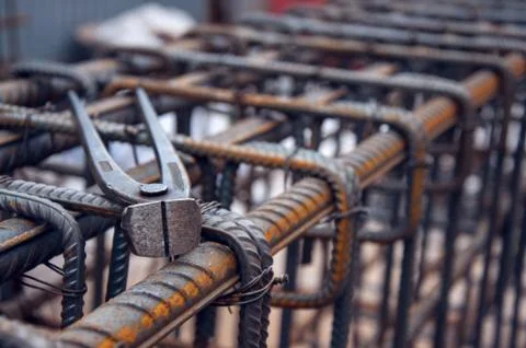 Concrete reinforcement. Tool at a construction site. The construction tool fo Stock Photos
