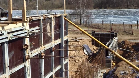Concrete the retaining wall and foundation for the terrace using formwork Video stock 194002896