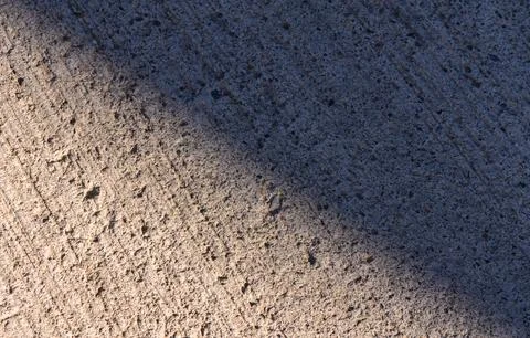 Concrete Road Texture with Diagonal Light and Shadow Stock Photos