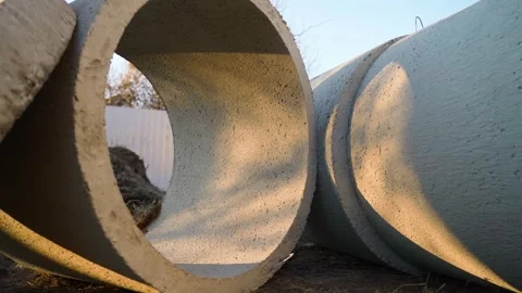 Concrete sewer rings lying on ground at construction site close-up Vídeos de archivo 337309764