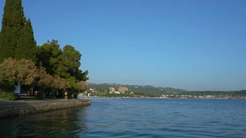 Concrete shore and a small touristic town Portorož Stock Footage 203781925