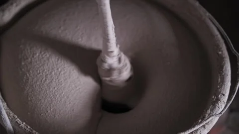 Concrete solution is mixed in a bucket at a construction site Stock Footage 247375428