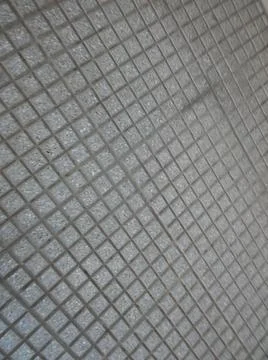 Concrete squared sidewalk background with different elements in street in day 스톡 사진