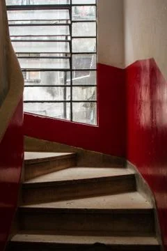 Concrete staircase with window. Stock Photos