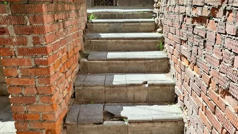 Concrete Stairway Between Exposed Brick Walls Leading to a Residential Entrance Vídeos de archivo 346441289