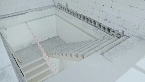 Concrete steps between floors. Under construction empty office space. Stock Footage 110706031
