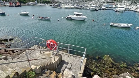 Concrete steps down to the water's edge in Brixham harbour Video stock 280922648
