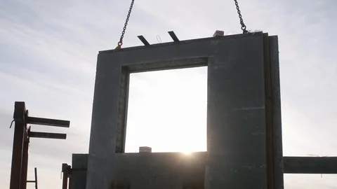 Concrete structure overlaps sun rays during building process Stock Footage 124299262