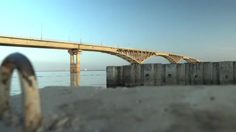Concrete structures in the river a against the background of the bridge Video stock 148103996