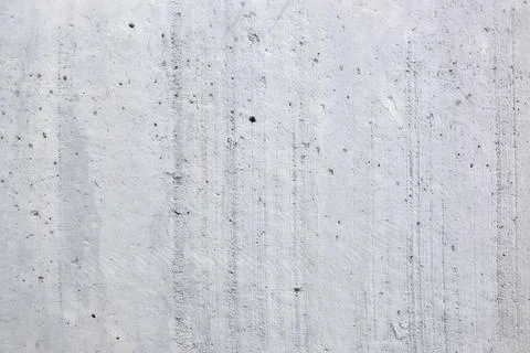 Concrete surface displays its texture and lines under natural light in Stock Photos