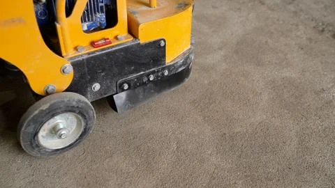 Concrete surface grinding machine smoothing industrial floor Stock Photos