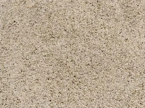 Concrete surface with multi-colored blotches of small stones. Light beige ton Stockfoto's