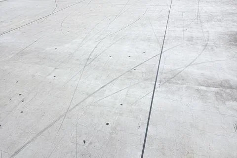 Concrete Surface with Tire Marks for Background or Texture in Urban Designs Stock Photos