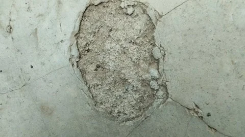Concrete surfaces are peeling or spalling Stock Footage 296473604