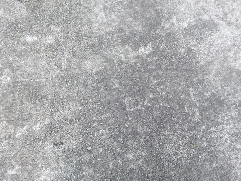 A concrete texture background showcasing the raw beauty of cement and stone. Stock-Fotos