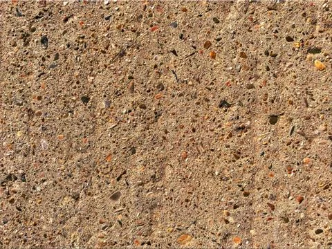 Concrete texture with small reddish stones Stock Photos