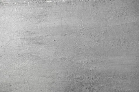 Concrete texture of wall painted in silver color with rough surface. Abstract Stock Photos