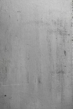 Concrete texture of wall with rough surface painted in silver color with shar Stock Photos