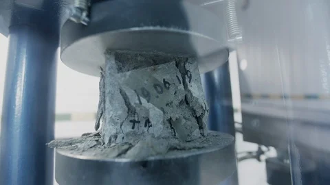 Concrete under press, concrete sample destruct under pressure in laboratory Stock Footage 116040357