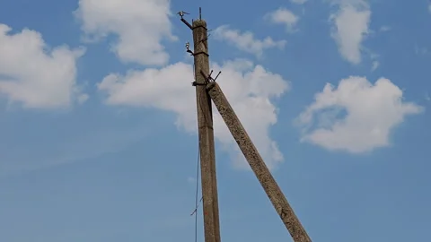Concrete utility pole and power lines in rural countryside landscape Stock Footage 339588052